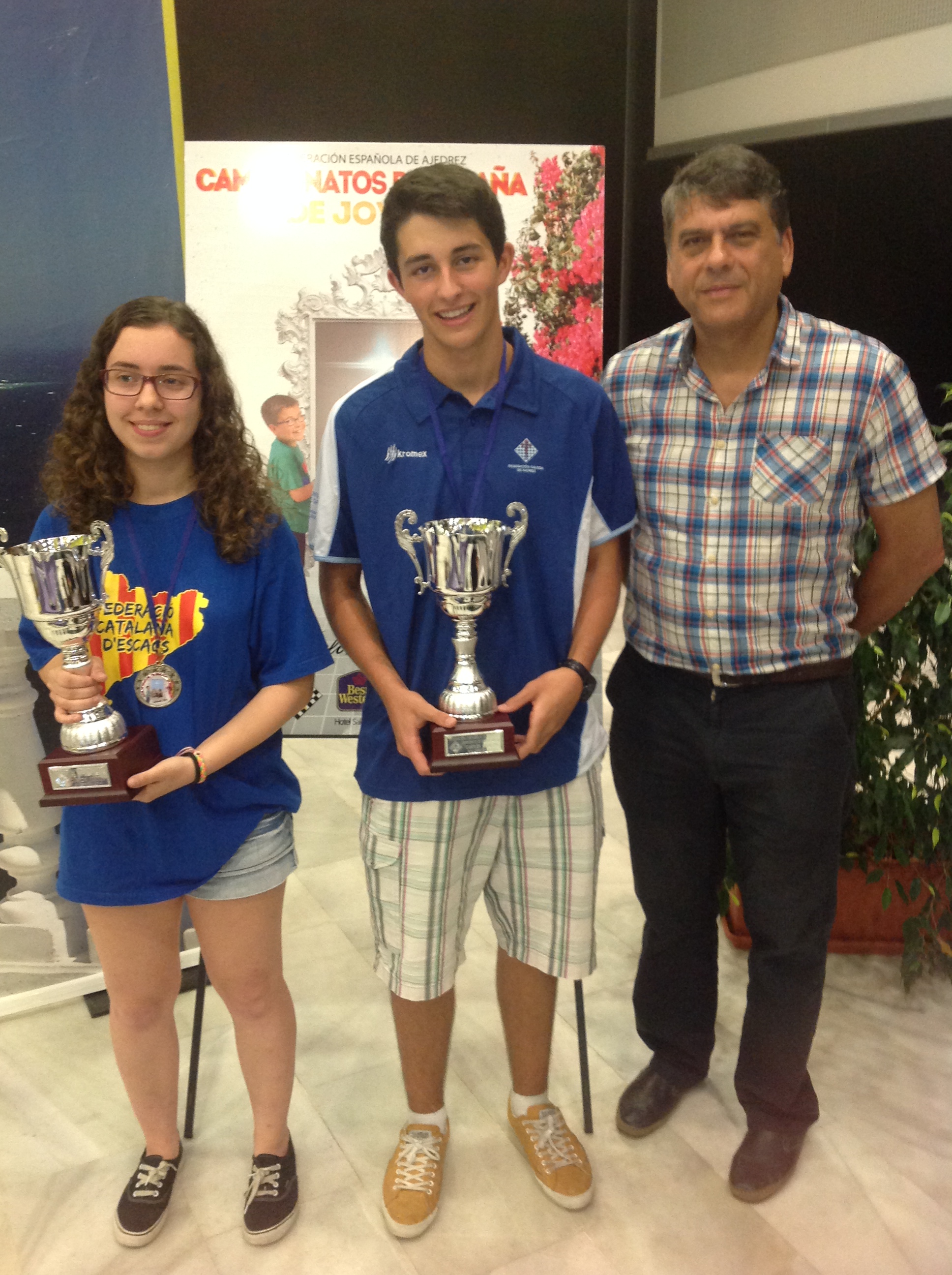 Julio Suárez, la campeona y Ochoa el presidente de la federación